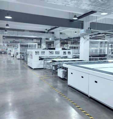 Workers assembling PV modules in LCSOLAR production line